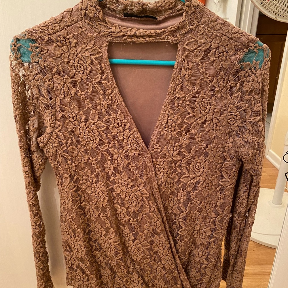Tan choker neck style lace blouse.